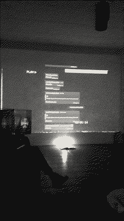 Projection with the survey chat in a dark room, with a candle on the floor